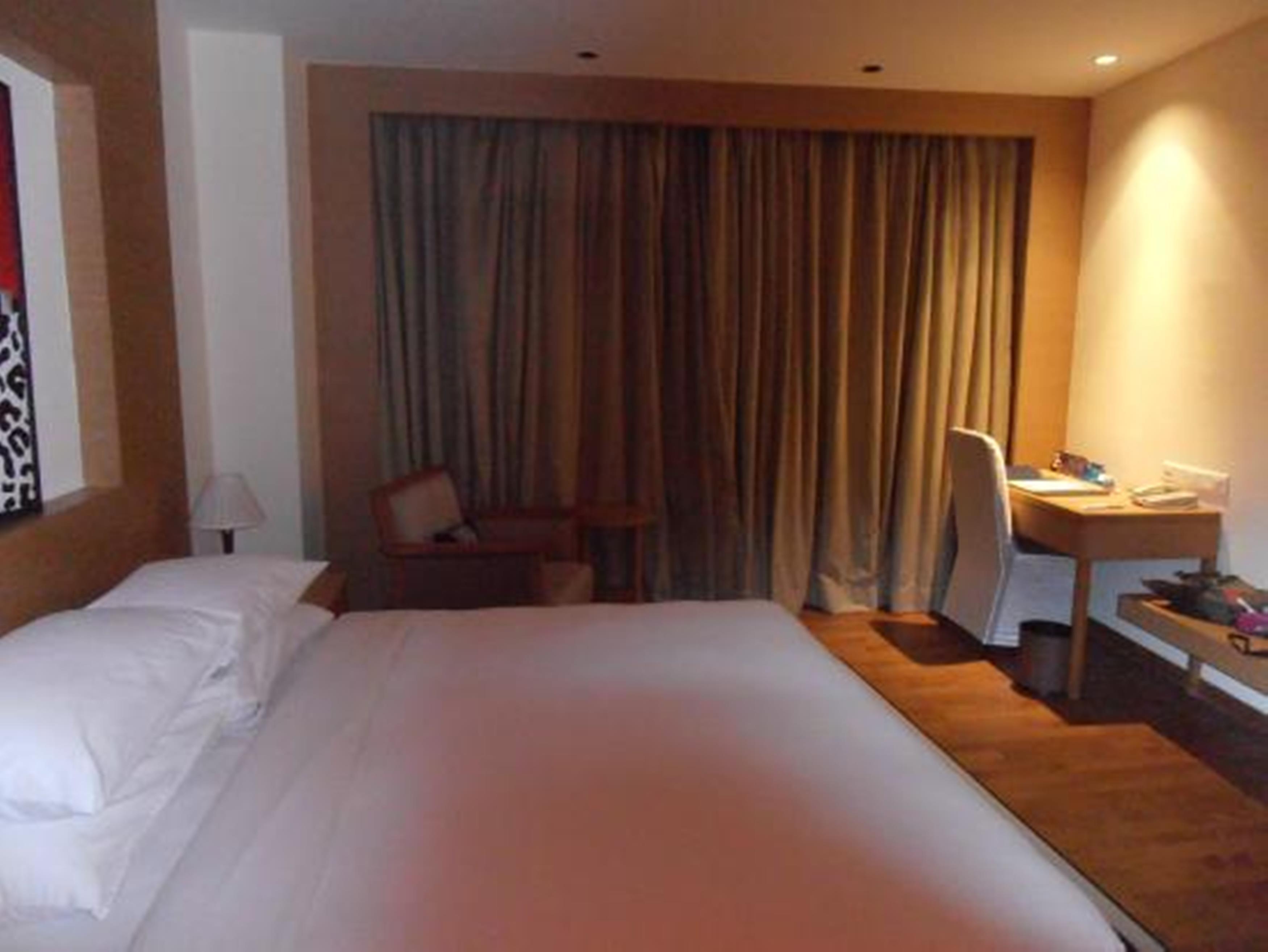 โรงแรมเรดิสันบลู นิวเดลี ทวาร์กา ภายนอก รูปภาพ A room at the hotel